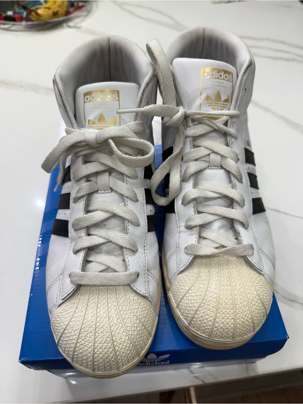 adidas Superstar RT White Sneakers with Black Stripes and Gold Logo